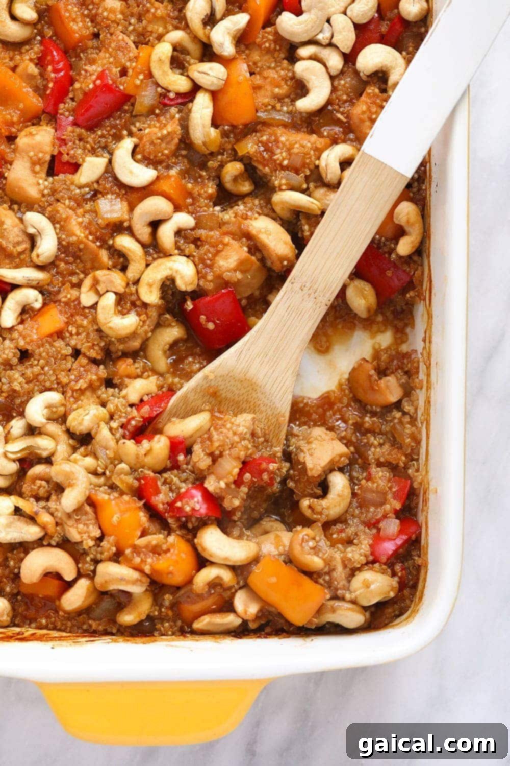 High-Protein Cashew Chicken Quinoa Bake - Perfect Meal Prep. A savory Cashew Chicken Quinoa Casserole in a baking dish, ready to serve.