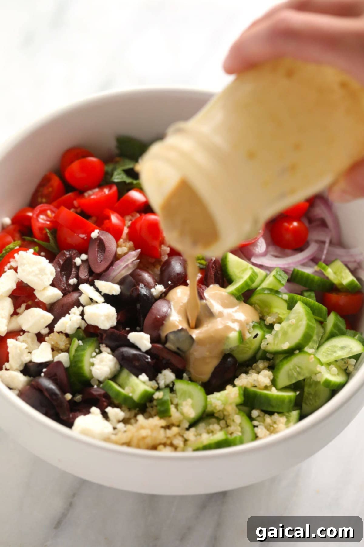 Fresh Ingredients for Mediterranean Quinoa Salad - Healthy & Flavorful All the fresh ingredients for Mediterranean Quinoa Salad laid out, alongside components for the hummus dressing.
