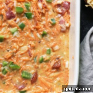 A healthy breakfast casserole with ham, cheese, and green onions.