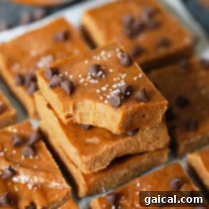 Healthy pumpkin freezer fudge squares on a wooden board