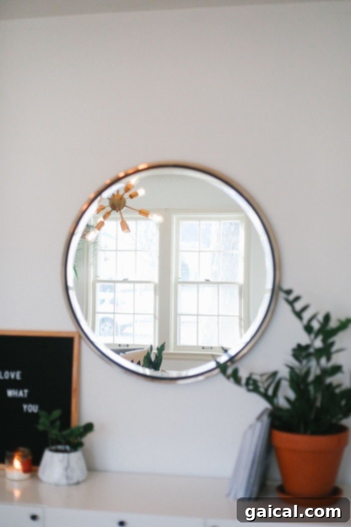 We're talking all things Fit Foodie HQ today with our mid-century home office room reveal! Check out our new multi-person workspace fully equipped with mid-century open shelving for our photography props, plants galore, lots of modern decor, and a wall tapestry! Gold Circle Mirror