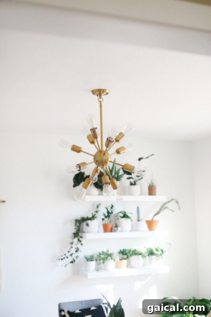 We're talking all things Fit Foodie HQ today with our mid-century home office room reveal! Check out our new multi-person workspace fully equipped with mid-century open shelving for our photography props, plants galore, lots of modern decor, and a wall tapestry! Sputnik fixture