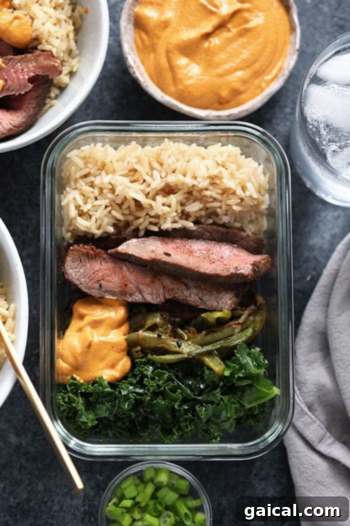 Five meal prep bowls stacked neatly, ready for storage, showcasing the efficiency of meal prepping.