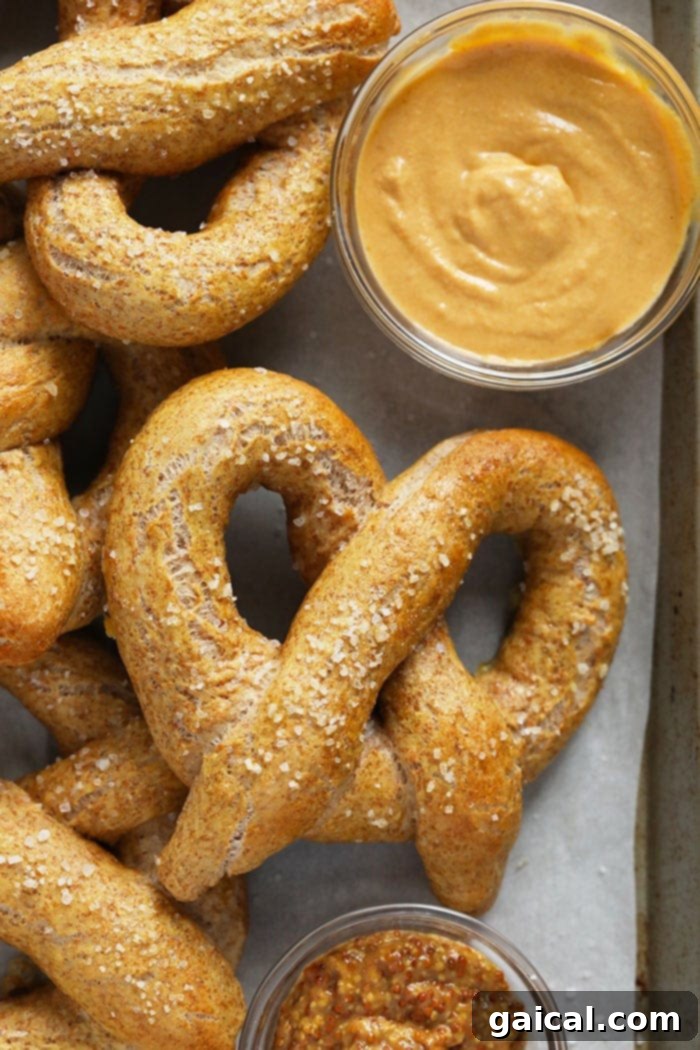 Guilt-Free Homemade Soft Pretzel Recipe 2 Freshly baked healthy soft pretzels on a cooling rack, ready to be enjoyed.