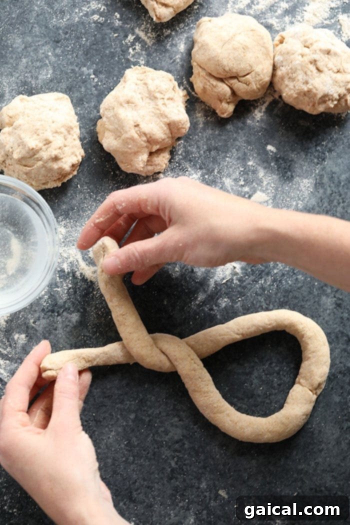 Guilt-Free Homemade Soft Pretzel Recipe 6 Dough rolled into a long rope, ready for shaping into a pretzel.