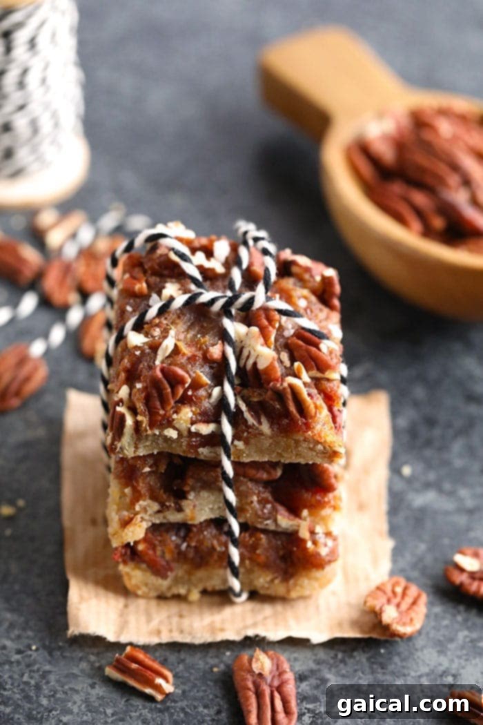 Pecan Pie Bars for Gifting A neat stack of easy pecan pie bars, artfully tied with twine, ready for gifting or serving.