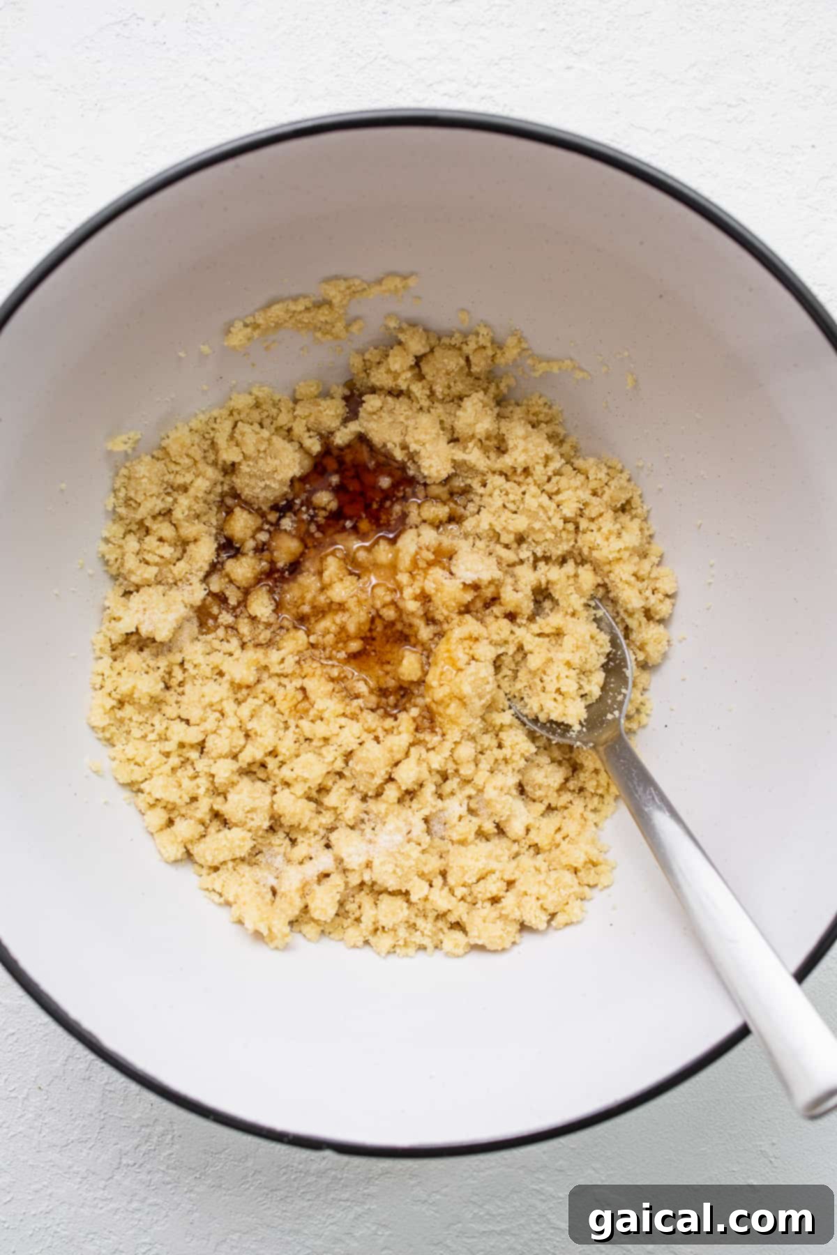 Delicate Almond Flour Shortbread 3 A bowl filled with finely ground almond flour, ready for baking. Other ingredients are neatly arranged around it.