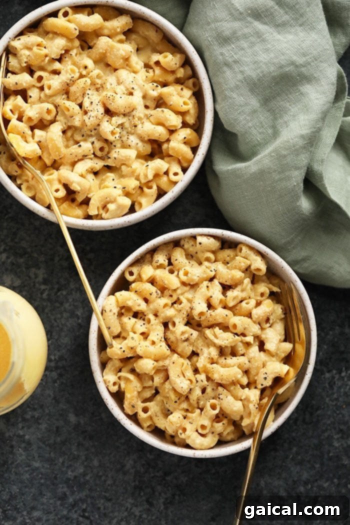 Multiple bowls of hot and ready-to-eat vegan mac and cheese, perfect for a family meal.