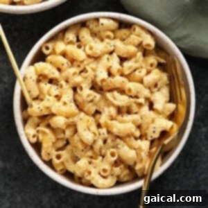 Two bowls of vegan mac and cheese, beautifully presented.