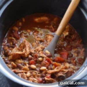 Effortless Slow Cooker Chicken Chili 4 Crockpot chicken chili with shredded chicken fully incorporated, ready for serving.