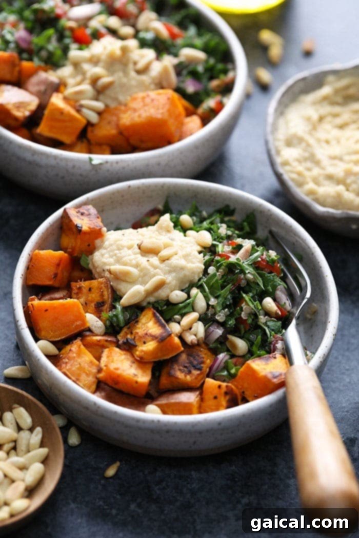 A beautifully arranged Mediterranean Vegan Buddha Bowl, showcasing roasted sweet potato, quinoa tabouli, and hummus for healthy meal prep.