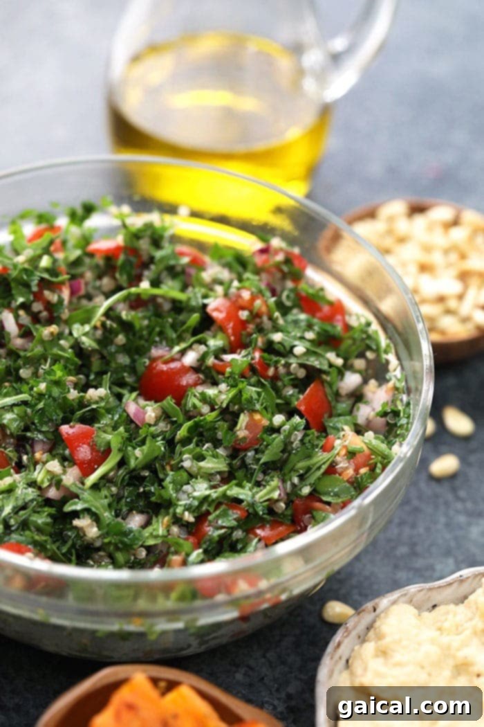 Close-up of fresh Quinoa Tabouli, a key component of the Mediterranean Vegan Buddha Bowl.
