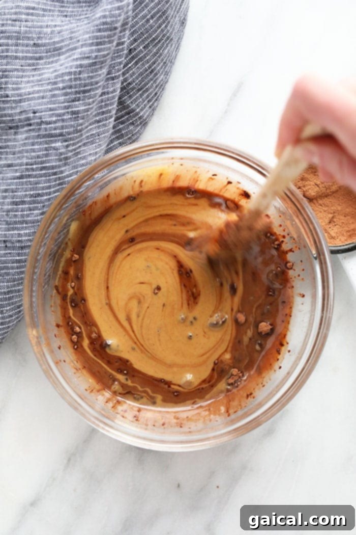 Chocolate Peanut Butter Keto Energy Bites 3 All ingredients for homemade Chocolate Peanut Butter Fat Bombs in a mixing bowl