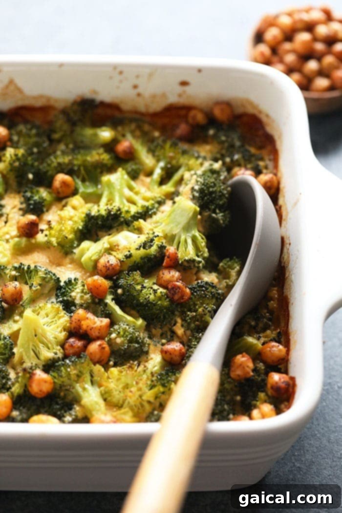 Plant-Based Cheesy Broccoli Bake 2 Creamy Vegan Broccoli and Cheese Casserole, served hot from the dish
