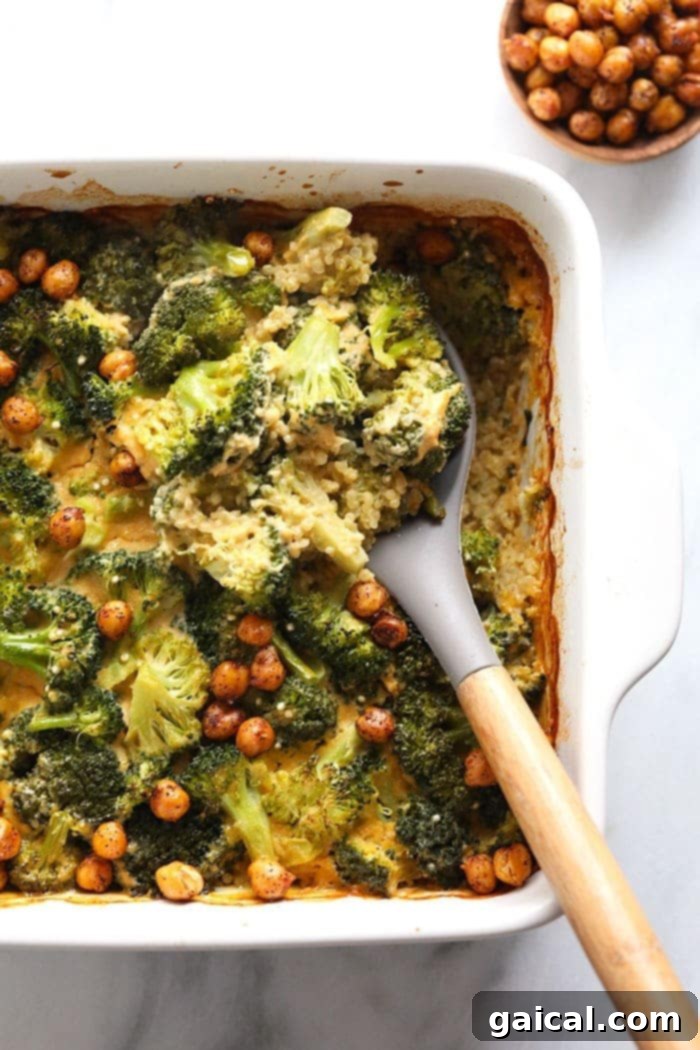 Plant-Based Cheesy Broccoli Bake 4 Serving a healthy vegan broccoli and cheese casserole with a spoon from a baking dish