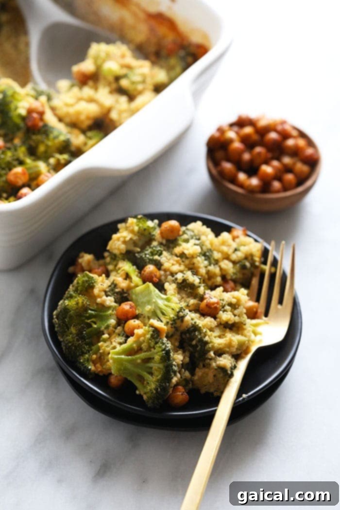 Plant-Based Cheesy Broccoli Bake 6 A plate of vegan broccoli and cheese casserole topped with crispy chickpeas