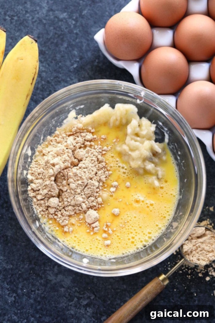 Simple Ingredients for Your Peanut Flour Pancakes Bowl with mashed bananas, eggs, and peanut flour, ready for mixing into pancake batter.
