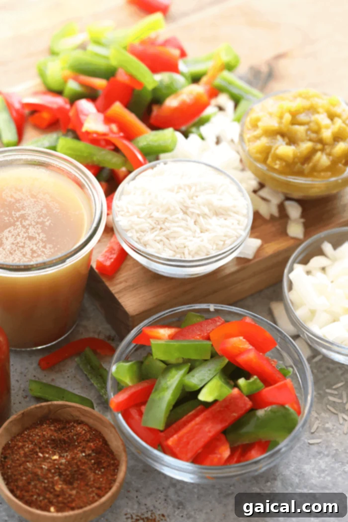Gathering fresh and wholesome ingredients for a delicious and easy Stuffed Pepper Soup. A vibrant and fresh collection of all the essential ingredients laid out on a wooden board, including colorful bell peppers, lean ground beef, onions, garlic, various spices, and tomato products, perfectly prepped for making Instant Pot Stuffed Pepper Soup.