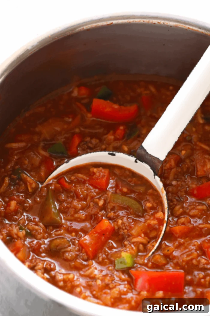 Hearty Instant Pot Stuffed Pepper Soup simmering to perfection. The Instant Pot, perfectly cooked and filled with bubbling Stuffed Pepper Soup, ready for serving, showcasing the tender beef, vibrant peppers, and rich tomato broth.