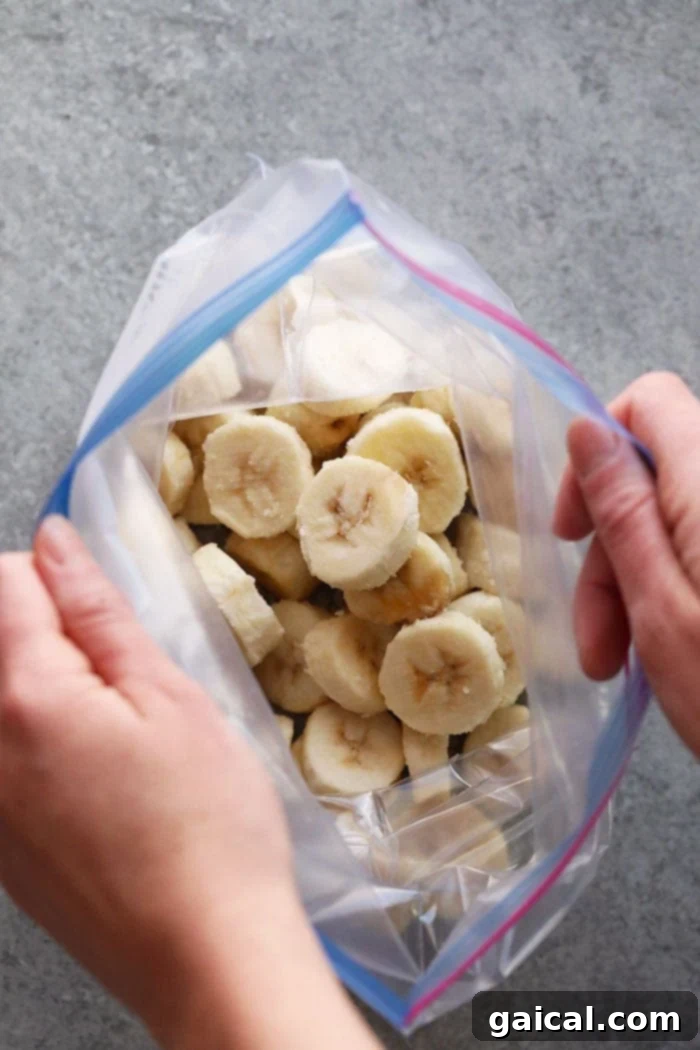 Stored Frozen Bananas in Freezer Bag Frozen sliced bananas neatly packed in a labeled, freezer-safe bag for storage