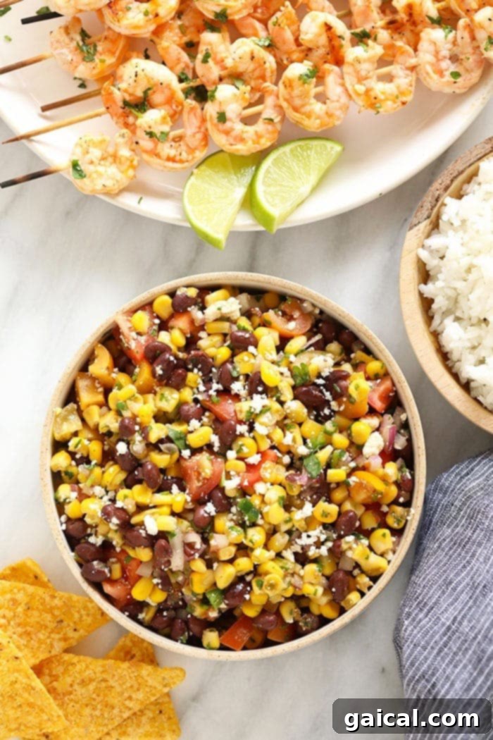 Refreshing Black Bean Corn Salad: Healthy and Simple A colorful bowl of black bean and corn salad, garnished with fresh cilantro, ready to be served