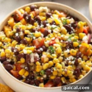 Mexican black bean corn salad with tortilla chips on the side