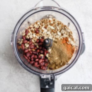 A food processor filled with black bean burger ingredients.