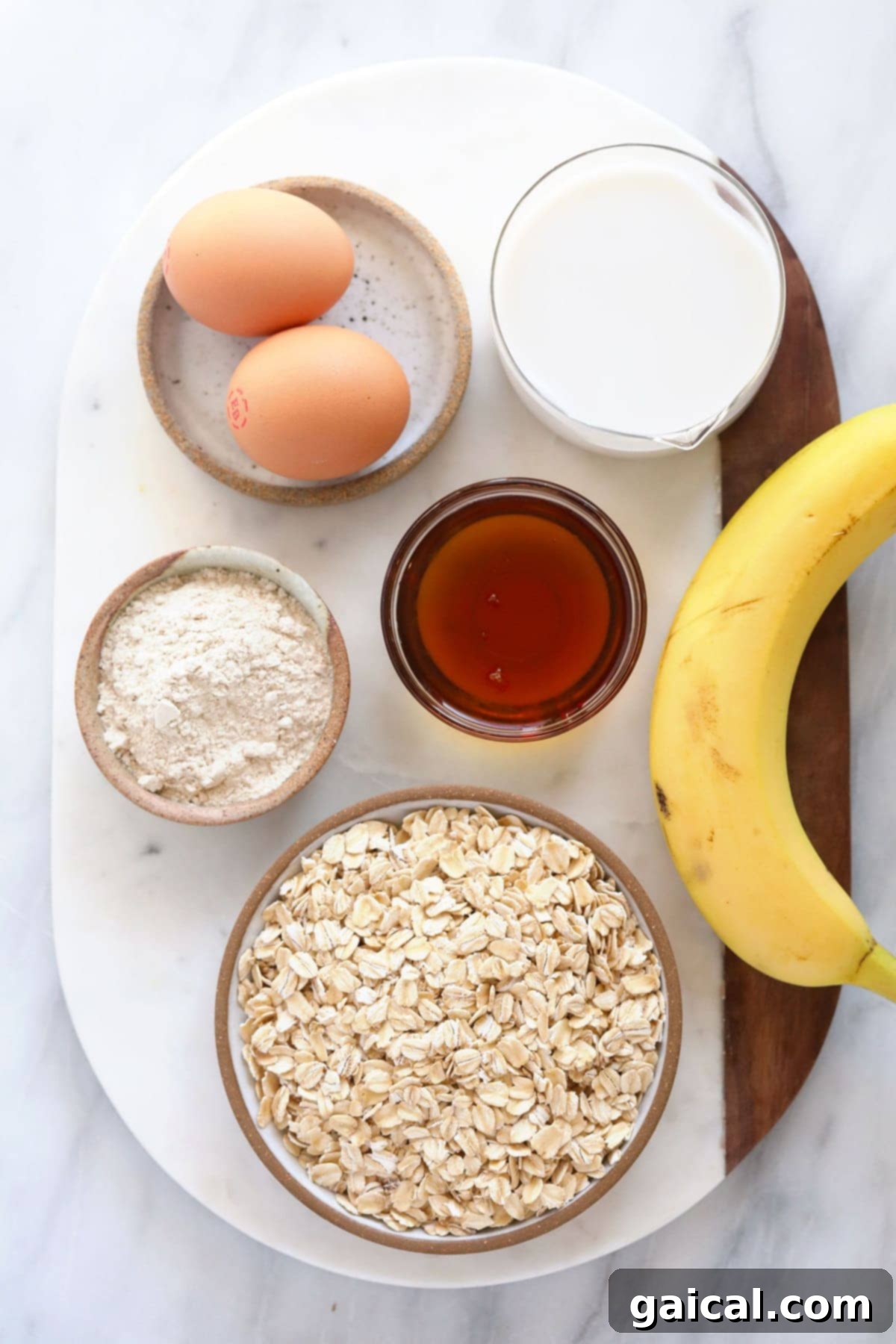 Oats, eggs, flour, banana, milk, and maple syrup — the wholesome ingredients that bring our baked oatmeal to life.