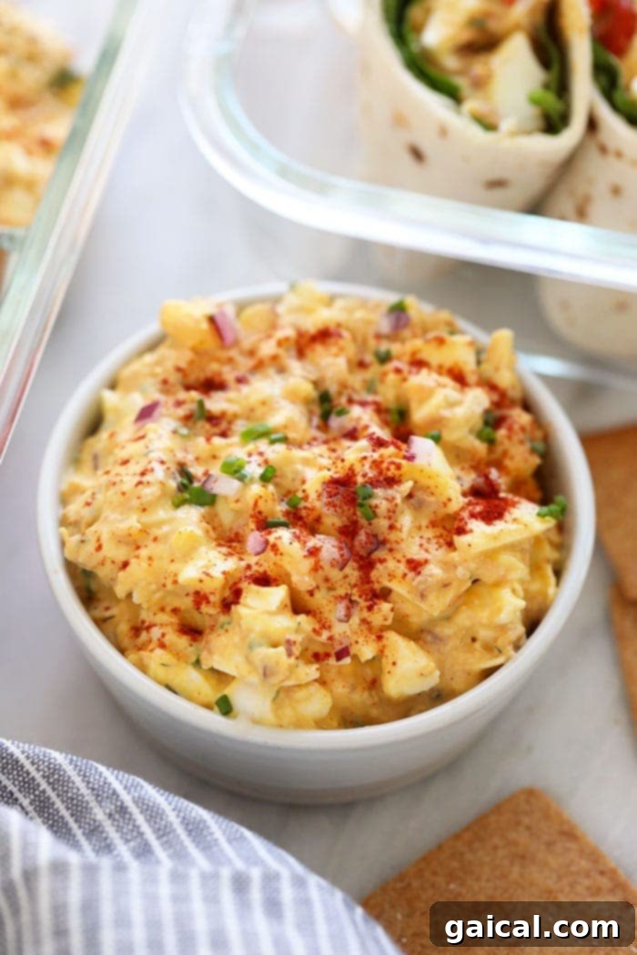 Hearty Tuna Egg Salad 7 A large bowl of fresh tuna egg salad, invitingly displayed and ready to be served, highlighting its rich, creamy texture.