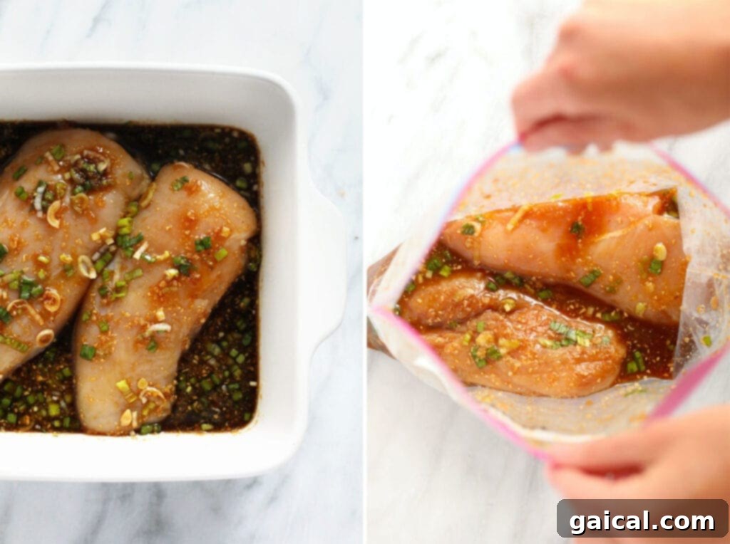 Chicken breasts marinating in teriyaki sauce in a large bowl.