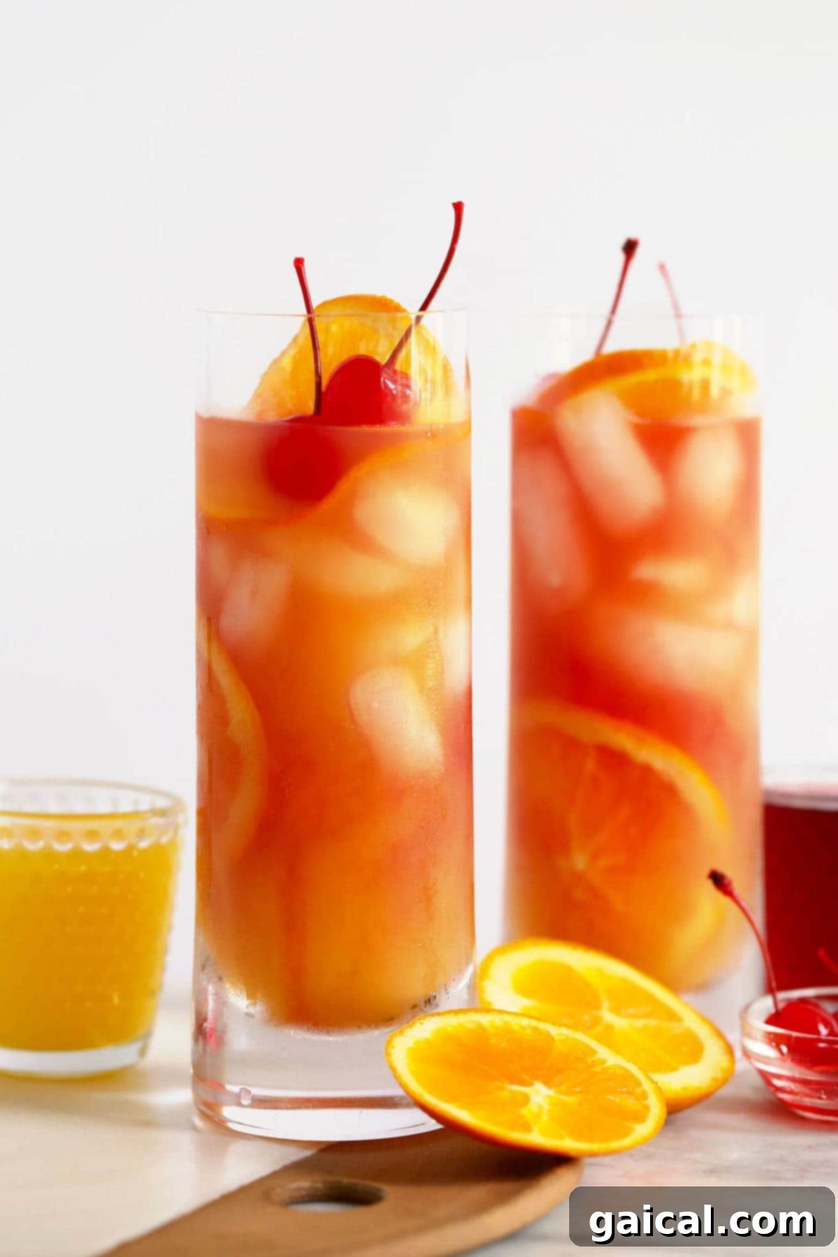 Over 15 Incredible Vodka Cocktail Recipes 11 Two glasses of the classic Sex on the Beach cocktail, adorned with orange slices and ice, ready to be enjoyed.
