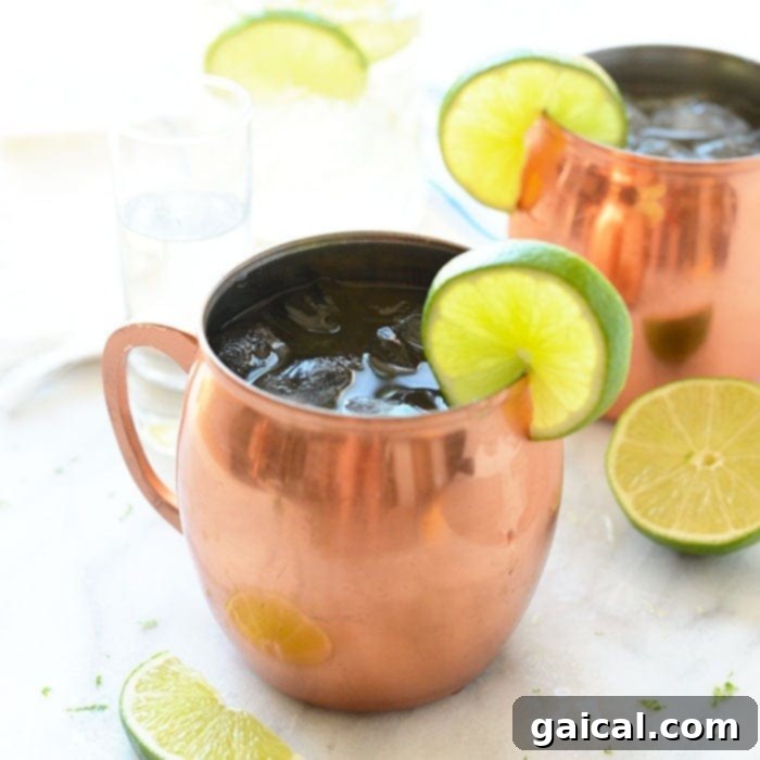 With just simple 3 ingredients you can make the most delicious, flavor-filled classic Moscow Mules perfect for a hot summer evening! A classic Moscow Mule in a frosty copper mug, garnished with a lime wedge, perfect for a refreshing summer drink.