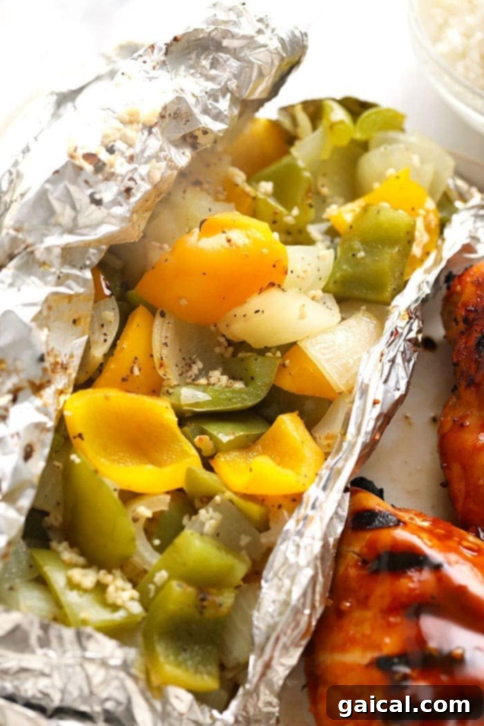 Peppers and onions are an easy thing to throw together for any summer meal! It compliments any piece of meat, burgers, etc. Our basic recipe only calls for 5 ingredients and a foil pack. Foil pack grilled peppers and onions, vibrant and ready for a summer meal