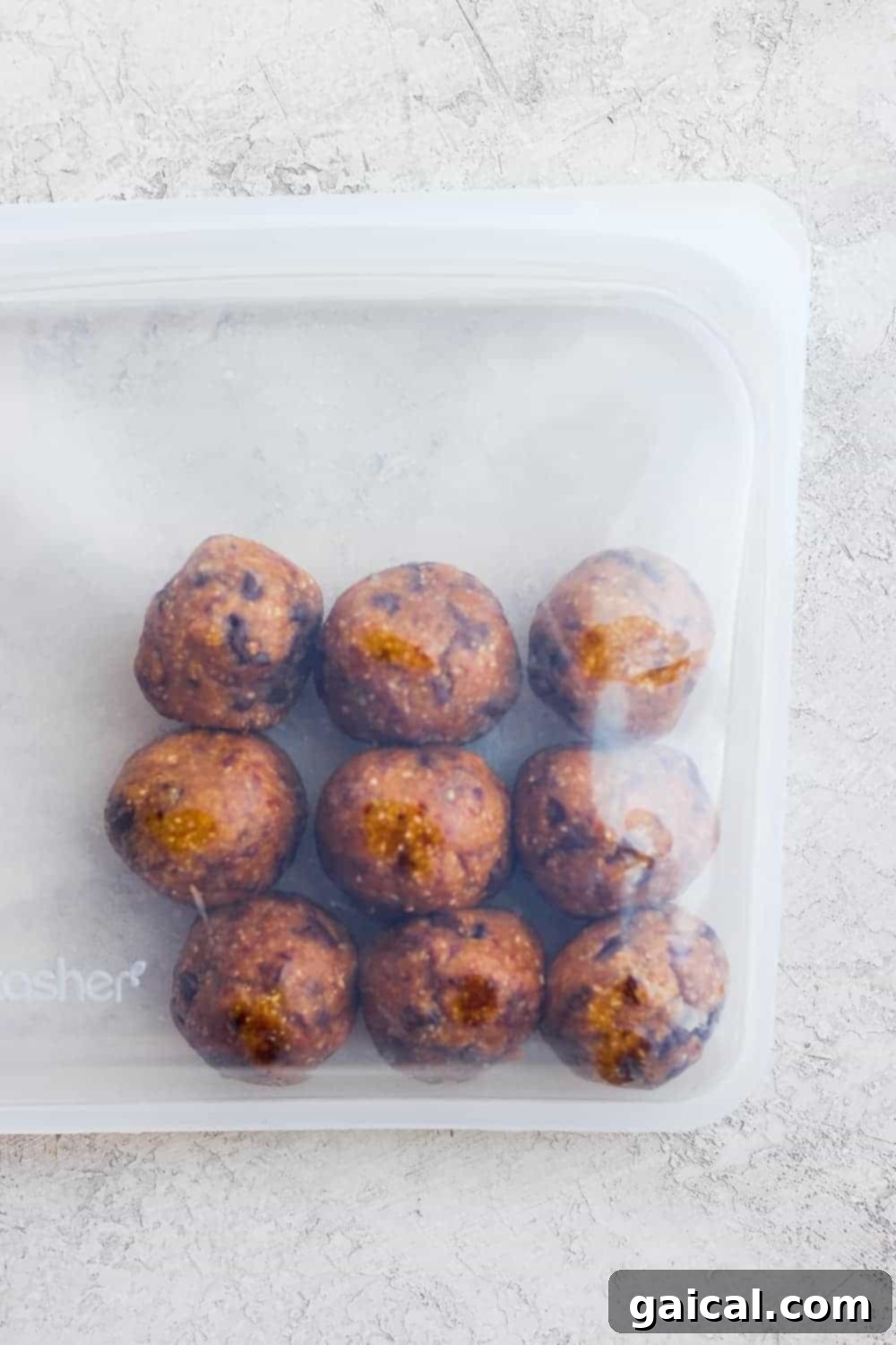 Freezer-Friendly Energy Bites: Smart Meal Prep Frozen cookie dough energy bites perfectly stored in a reusable Stasher bag, ready for long-term enjoyment.