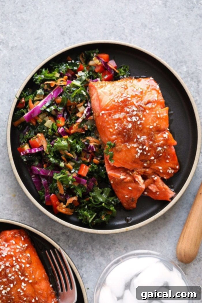 maple ginger baked salmon on a plate, garnished and ready to serve