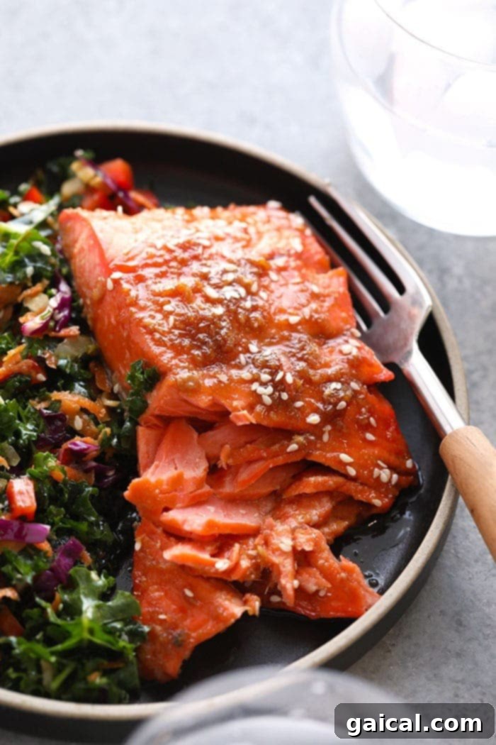 Serving Maple Ginger Baked Salmon maple ginger baked salmon on a clean white plate, ready for consumption