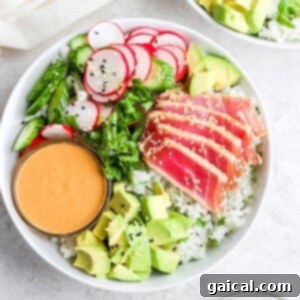 Ahi tuna salad with arugula, served with a dipping sauce.