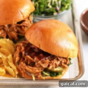 Delicious pulled BBQ chicken, ready to be served on a bun or in a bowl.
