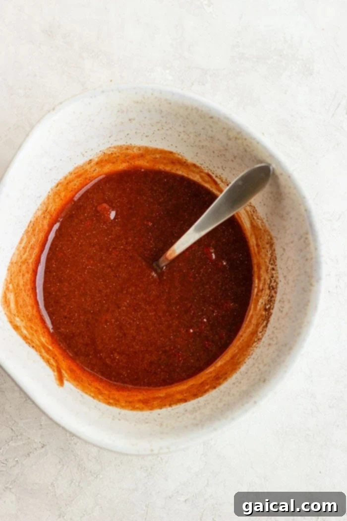 homemade healthy sloppy joe sauce in a white bowl, showing its rich texture and color