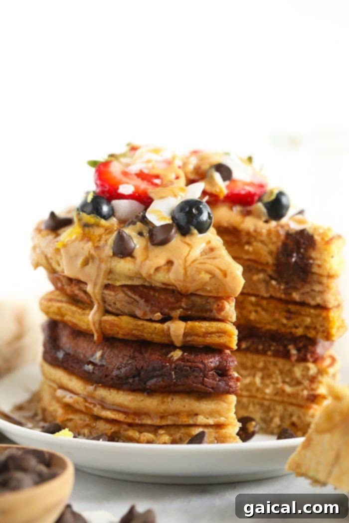 A vibrant and appealing stack of healthy pancakes adorned with various delicious toppings.