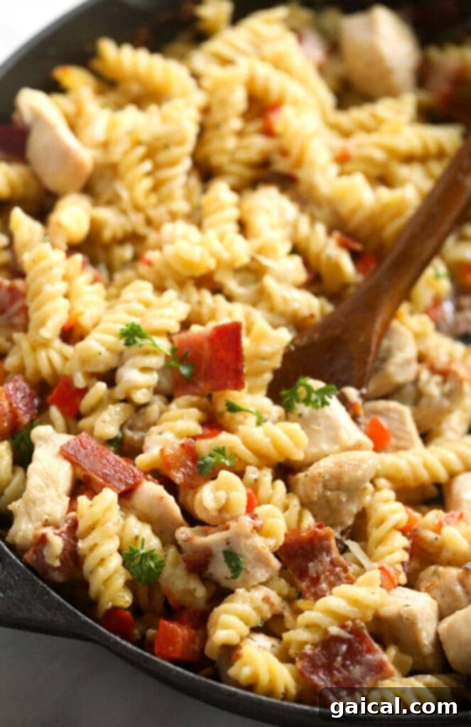 All the flavors you love in casserole form! Make this Chicken Bacon Ranch Casserole for an easy and delicious dinner the whole family will love. Chicken bacon ranch casserole in a cast iron skillet