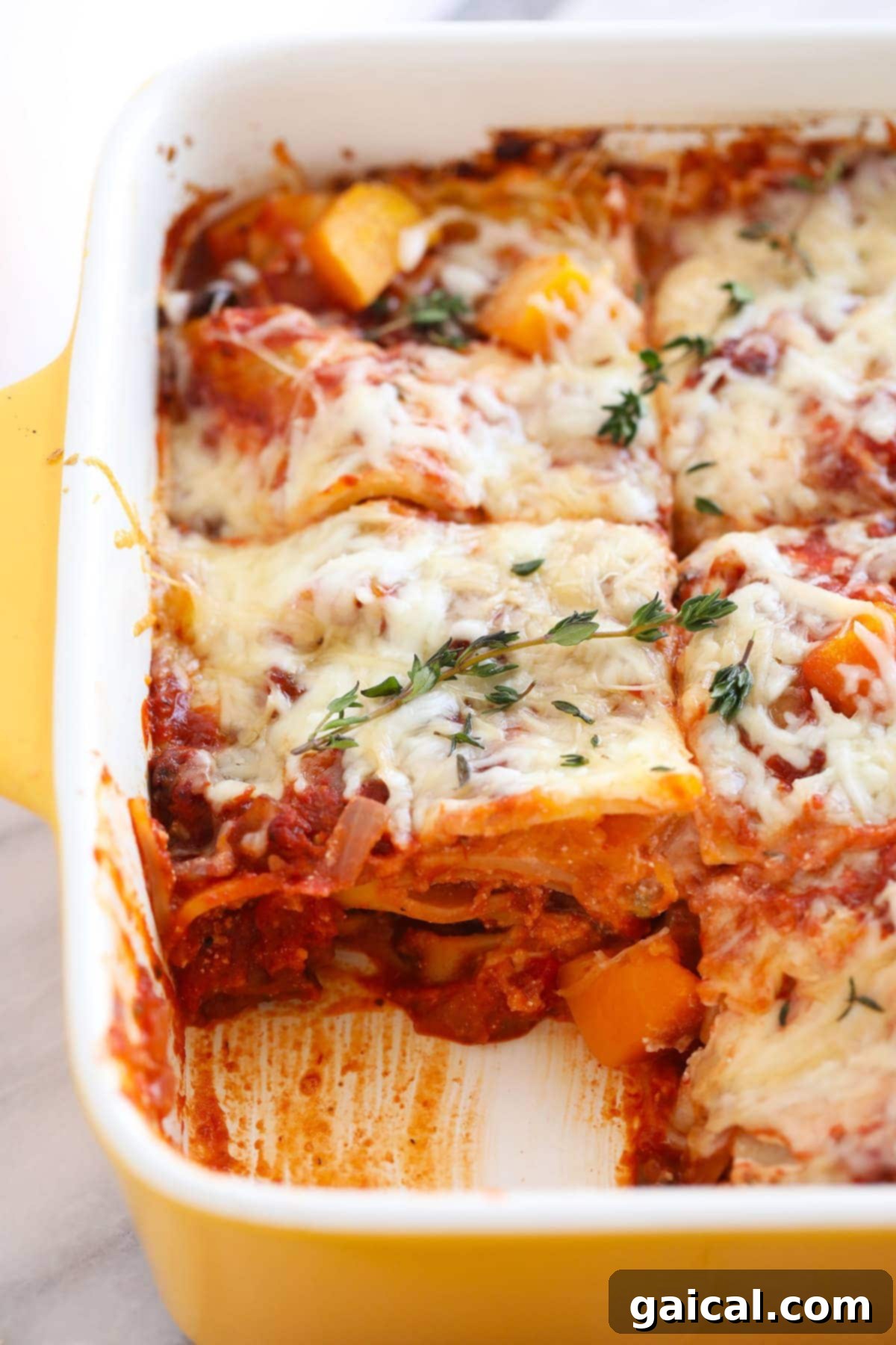 A cross-section of the healthy butternut squash lasagna, showcasing its perfectly cooked, creamy, and flavorful layers.