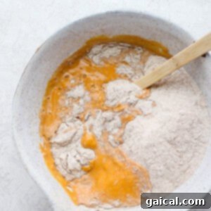 Dreamy Pumpkin Pancakes 9 Pumpkin pancake batter in a mixing bowl, showing its thick, smooth consistency.