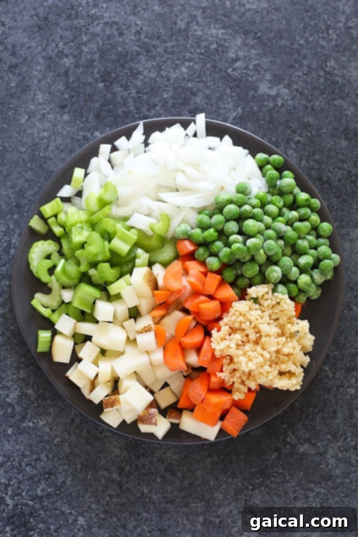 Fresh Vegetables: The Heart of a Healthy Chicken Orzo Soup A vibrant assortment of fresh vegetables including carrots, celery, onions, and potatoes, ready for soup preparation