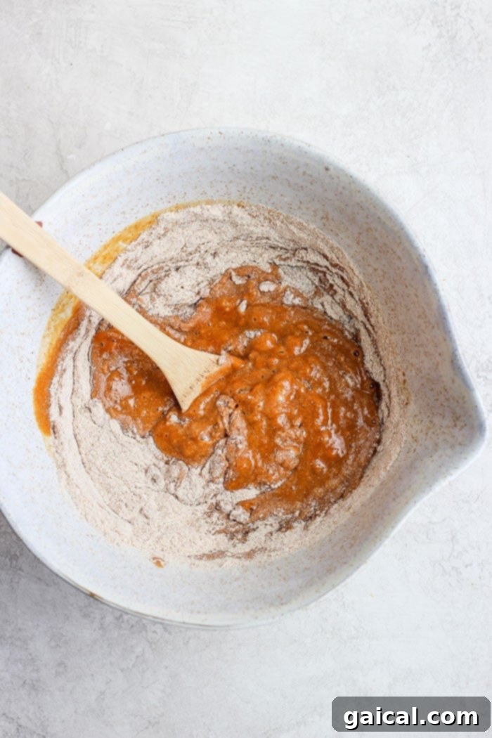 Gathering the wholesome ingredients for our healthy pumpkin bread. Essential ingredients for healthy pumpkin bread laid out in a bowl, ready for mixing.