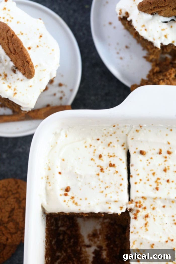 Frosted Gingerbread Perfection a beautifully frosted gingerbread loaf, topped with cream cheese and a sprinkle of cinnamon, ready to be served