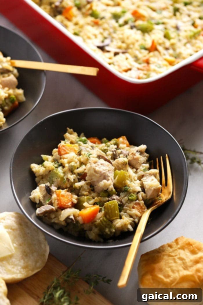 This lighter-fare Chicken Pot Pie Casserole is jam-packed with veggies, lean chicken, and that amazing creamy pop pie flavor! pot pie casserole in bowl