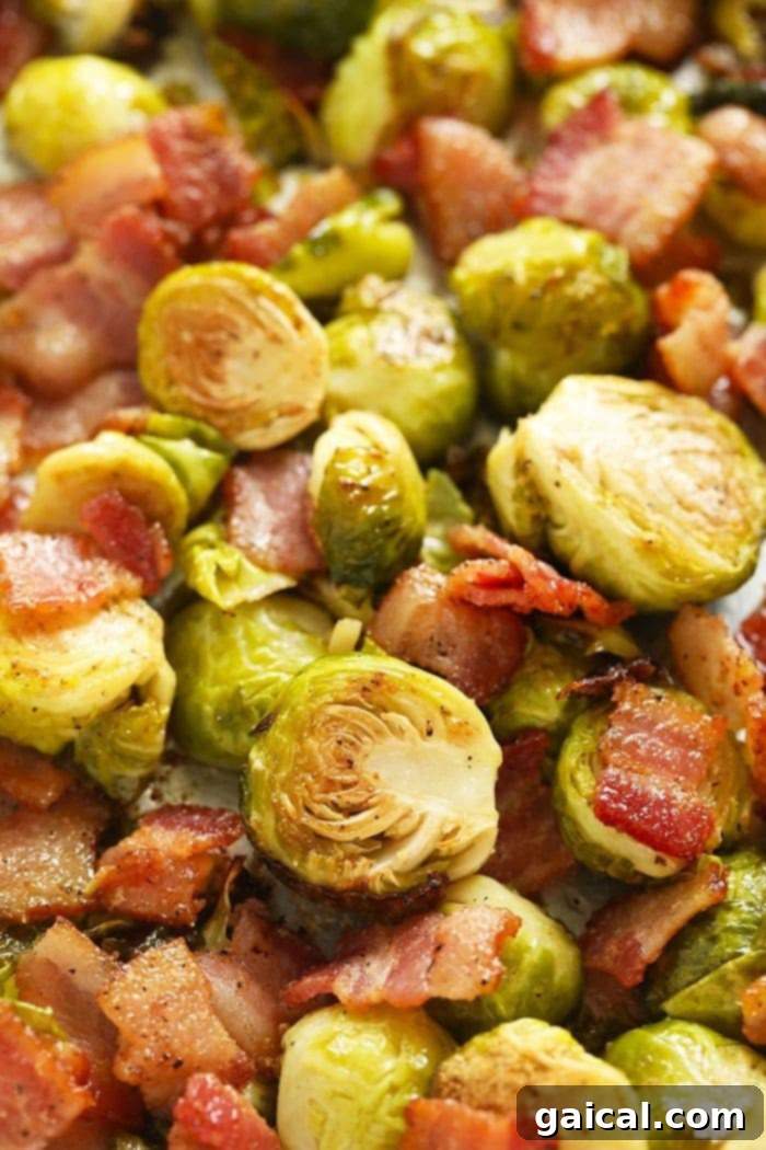 Roasted Brussels Sprouts with Crispy Bacon 7 Close-up of golden brown roasted Brussels sprouts with bacon in a serving bowl, showcasing the crispy edges.