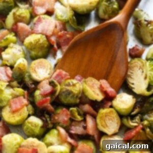 Roasted Brussels Sprouts with Crispy Bacon 8 Roasted Brussels sprouts with bacon in a dish.