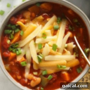 Flavorful vegetarian chili in a bowl with delicious toppings.